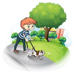 Fotobehang Honden Een jongen die met zijn hond over straat loopt