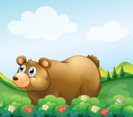 Fotobehang Een bruine beer in de aardbeientuin © GraphicsRF