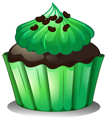 A chocolate cupcake with green toppings