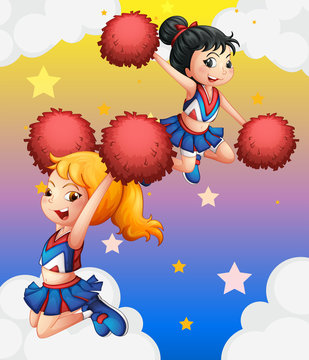 Cheerdancers with red pompoms