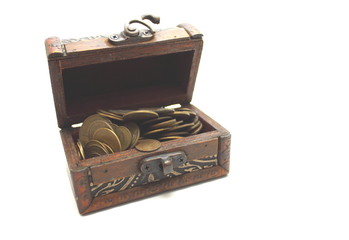 Open chest with old money on a white background