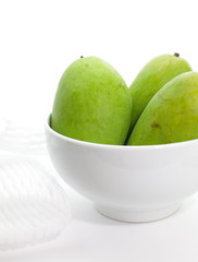 Green mango isolated on a white background