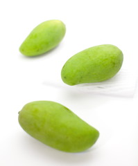 Green mango isolated on a white background