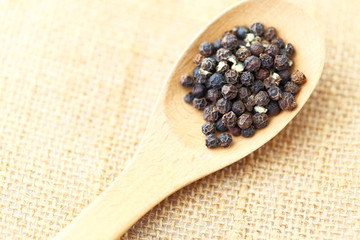 pepper in wooden spoon