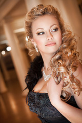 Fashion beautiful blonde woman with diamond jewelry