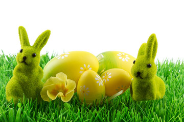 easter bunny with easter eggs on green grass