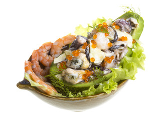 Seafood salad with red caviar in avocado