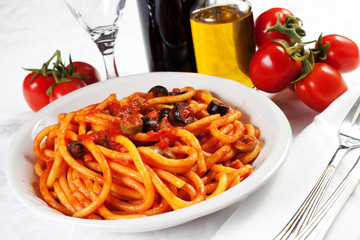 pasta with olives, bacon and sauce