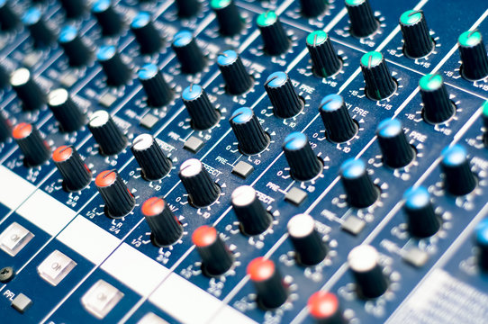 Music mixer in studio, close-up of audio controls