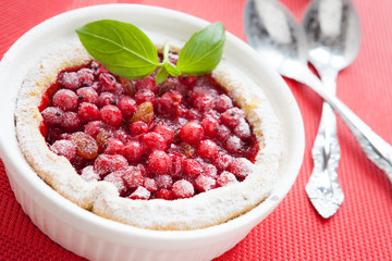 berry pudding in white baking dish