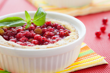 berry pie in white baking dish