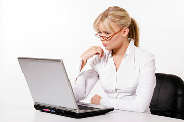 Beautiful young woman working with laptop