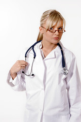 Young blonde woman doctor on white background