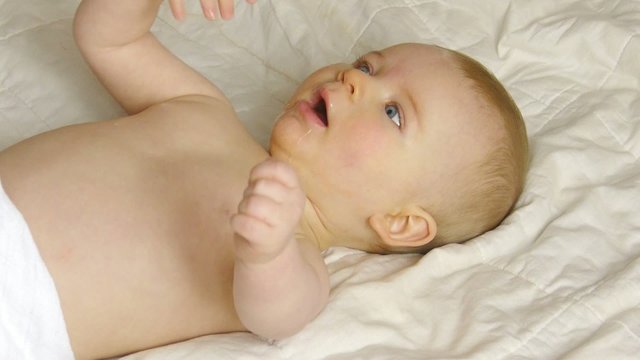 HD1080p Baby laying on a blanket and making strange noise