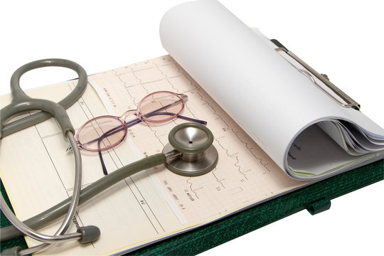 Stethoscope and glasses on electrocardiogram chart