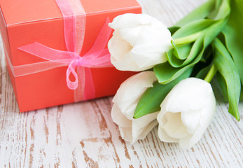 bouquet of  tulips, gift box on a table