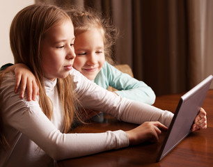 Children playing on tablet