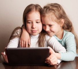 Children playing on tablet