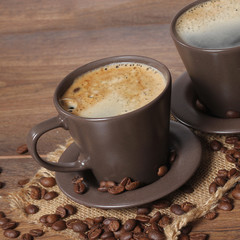 cup of coffee on wooden background 