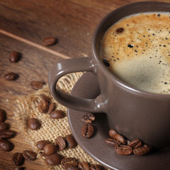 cup of coffee on wooden background 