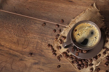 cup of coffee on wooden background 