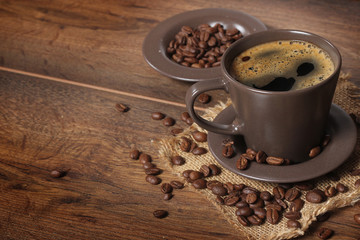 cup of coffee on wooden background 