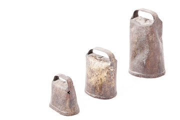 Old and rusty cowbells isolated