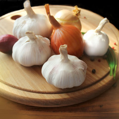 Garlic and onion on cutting board