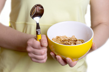 Diet - girl holding a yellow bowl of cereal