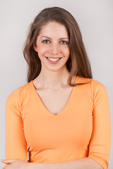 Obraz premium Nice woman in an orange shirt