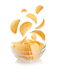 Bowl of potato chips isolated on a white