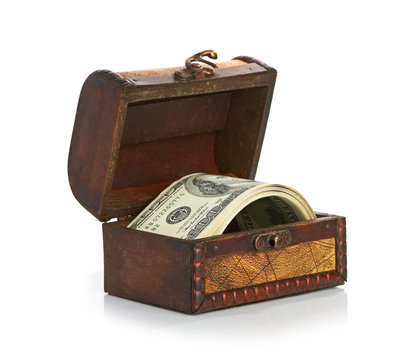 Dollar-bills in the old wooden treasure chest