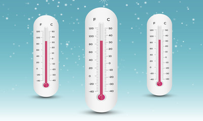 thermometer in the winter on a blue background. snowflakes