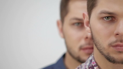 one twin is behind the other