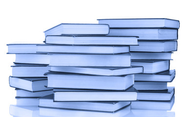 Stack of books in blue light