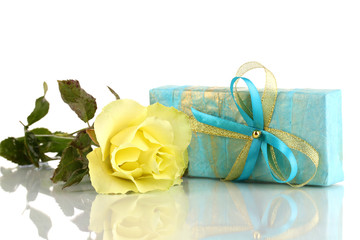 Beautiful yellow rose with wonderful gift in blue box isolated