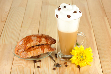 glass of fresh coffee cocktail and saucer with bagels