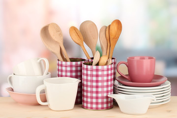 Cups, bowls nd other utensils in metal containers isolated