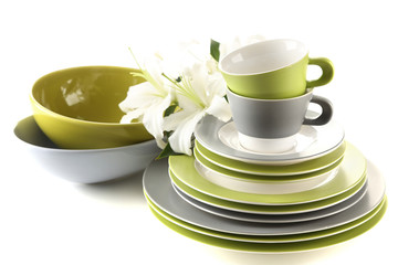Empty bowls, plates and cups isolated on white