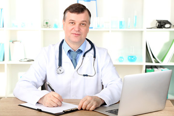 Medical doctor working at desk