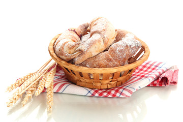 Taste croissants in basket isolated on white.