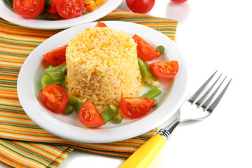 Delicious risotto with vegetables isolated on white