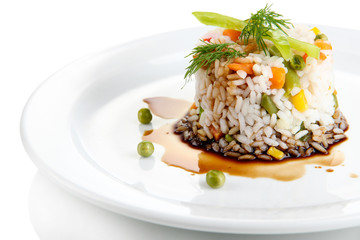 Delicious risotto with vegetables, isolated on white