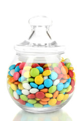 Colorful candies in glass jar isolated on white