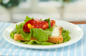 Salami rolls with paprika pieces inside,