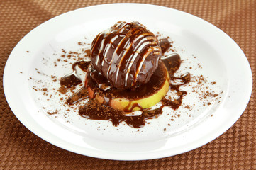 Chocolate dessert on big plate close up