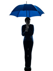 anxious woman holding umbrella silhouette