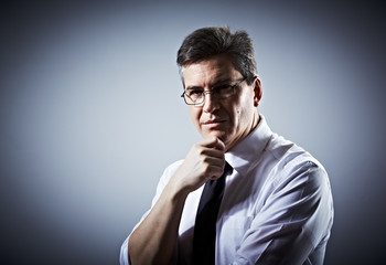 Thinking businessman.