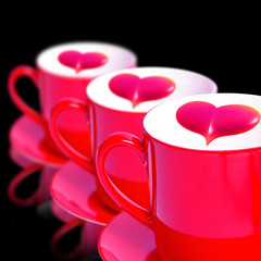 Three red mugs with heart