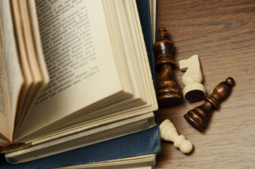 old book and wooden chess